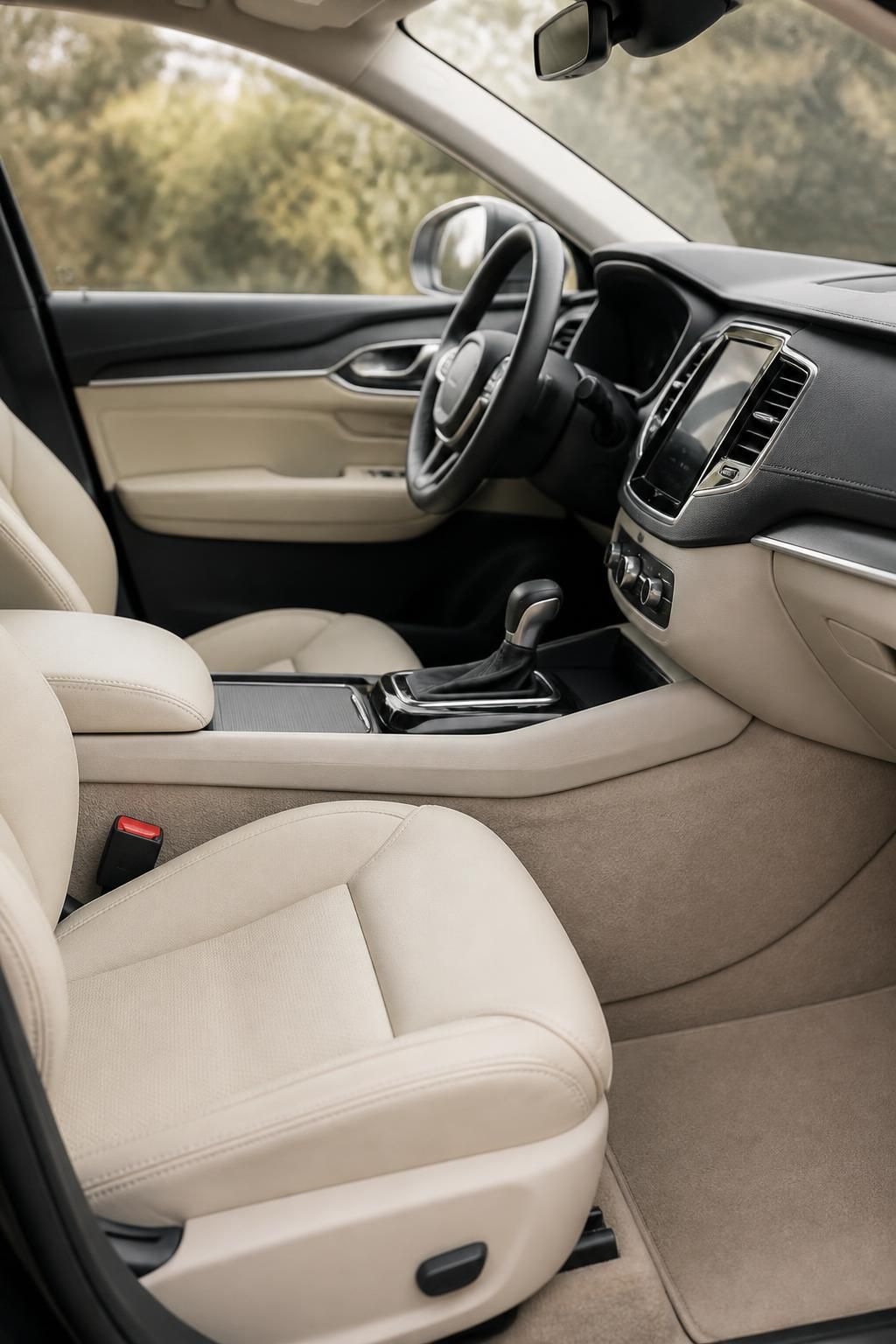 Spotless vehicle interior with clean leather seats and dashboard surfaces.