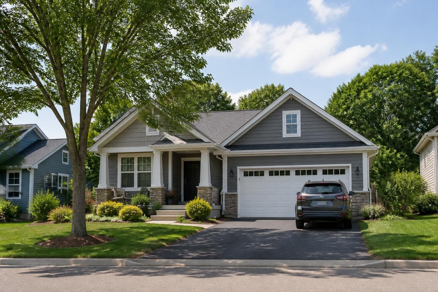 Clean suburban street with homes, trees, and a parked car in Princeton.